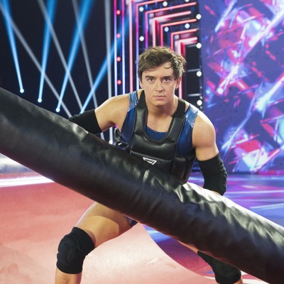 Apollo holding a padded pole in the Gauntlet of BBC One's Gladiators