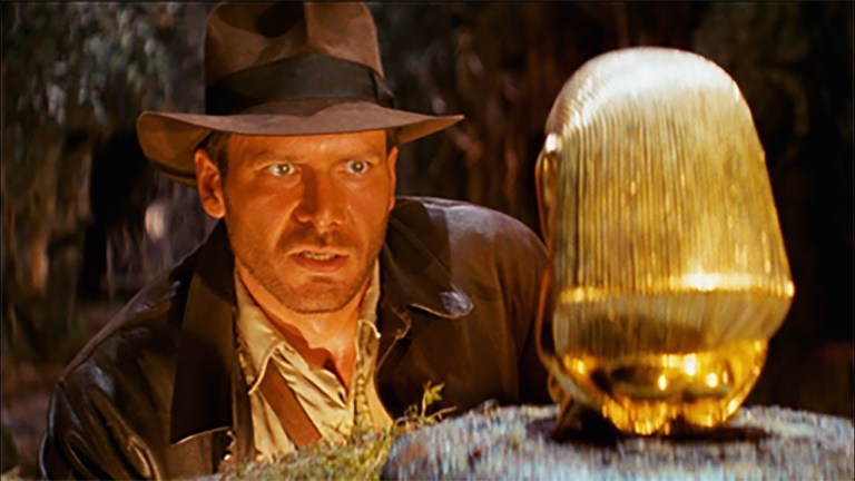 Indiana Jones and gold statue in Raiders of the Lost Ark